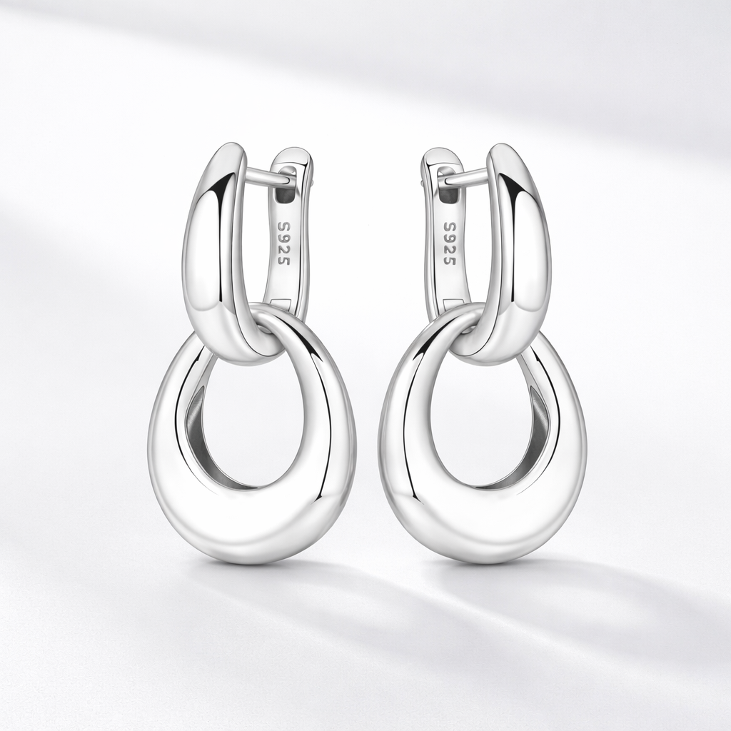 Double silver hops in silver in a nice light gray studio. 