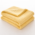 Gult pledd i et studio. 