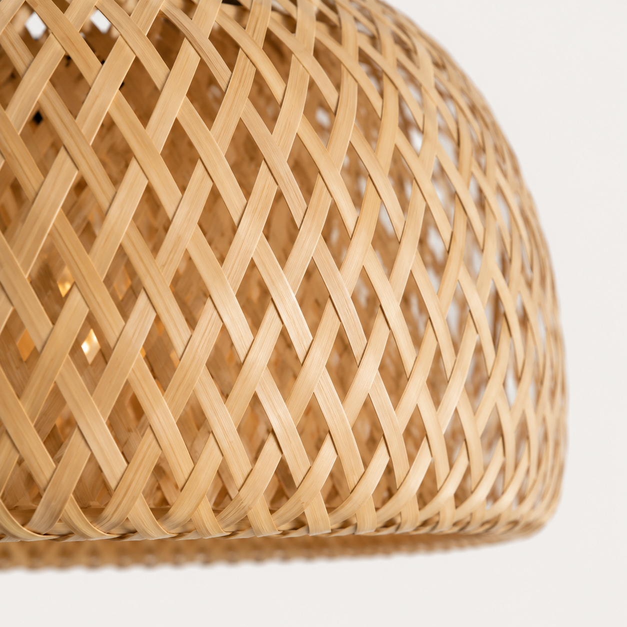 Closeup of a rattan lamp in a white studio. 