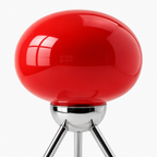 Rød lampe i oval form i et hvitt studio.
