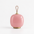 Trådløs bærbar lampe i rosa glass med bærehåndtak