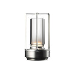 En LED oppladbar lampe til ute og innebruk i sølv.